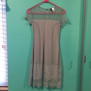 A vintage-style mossy green dress